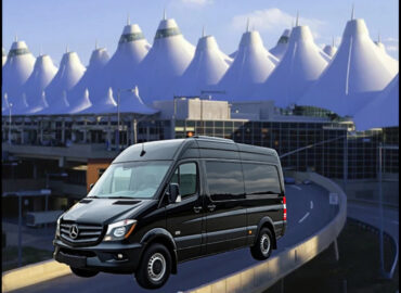 Black Sprinter van in front of Denver International Airport