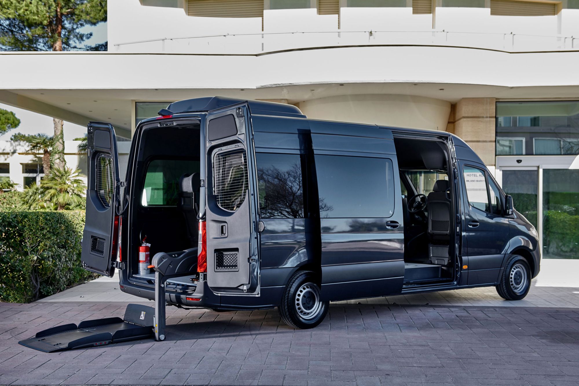 black Mercedes Sprinter with wheelchair lift